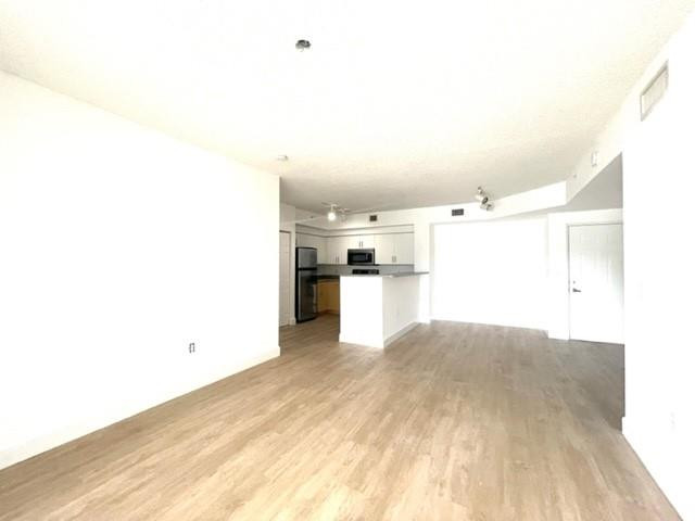 7930 North Nob Hill Road, Unit 106 Tamarac, FL 33321 - Photo 7 of 12 a view of a kitchen with a sink