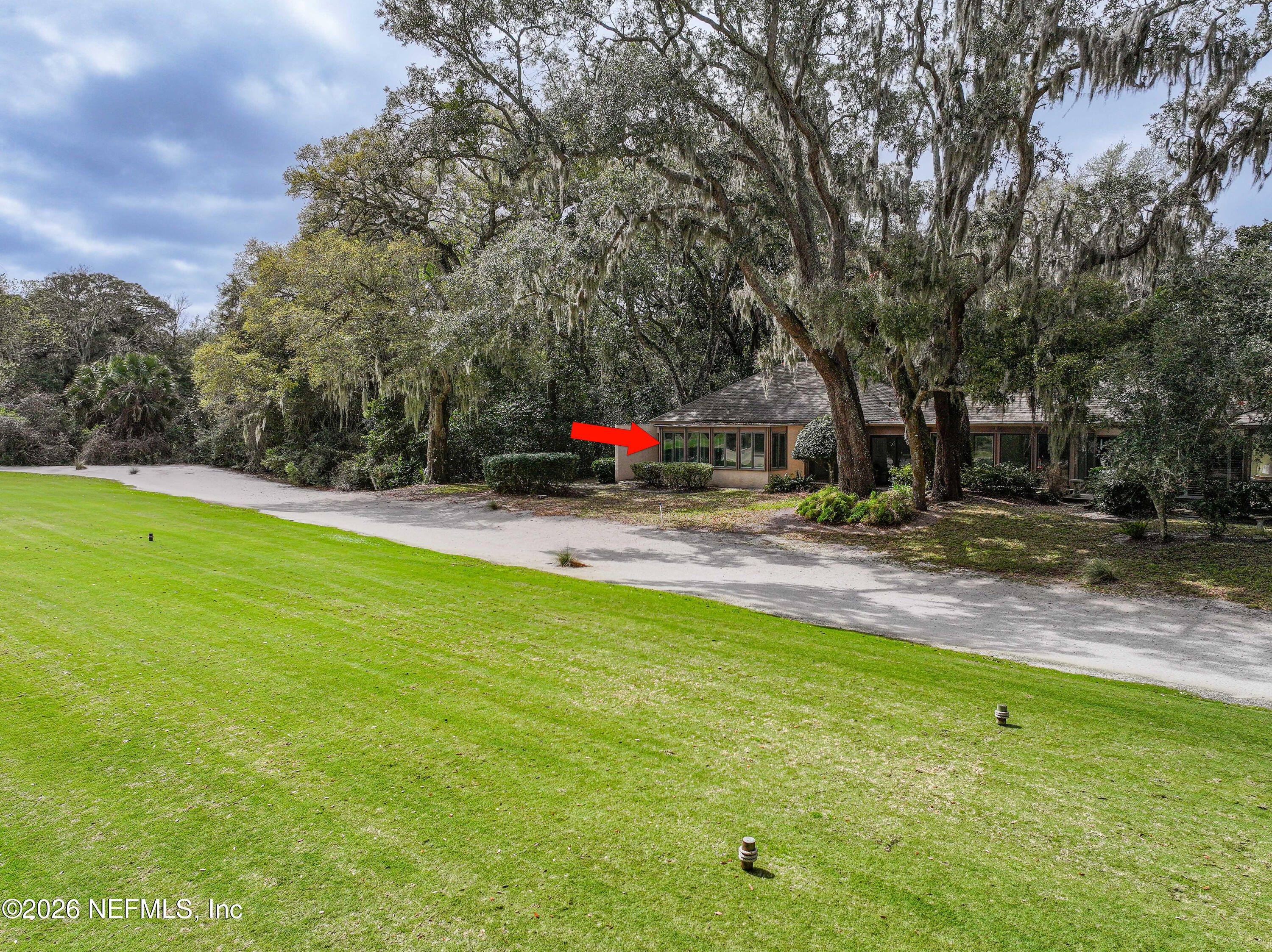 3301 Sea Marsh Road Fernandina Beach, FL 32034 - Photo 37 of 41 a view of yard with swimming pool and trees