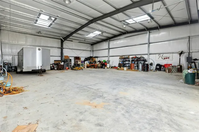 a white house that has a tree in front of it