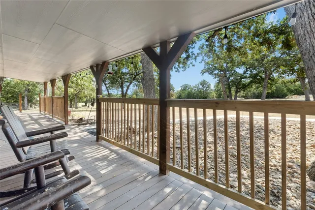 a view of a two chairs in the balcony