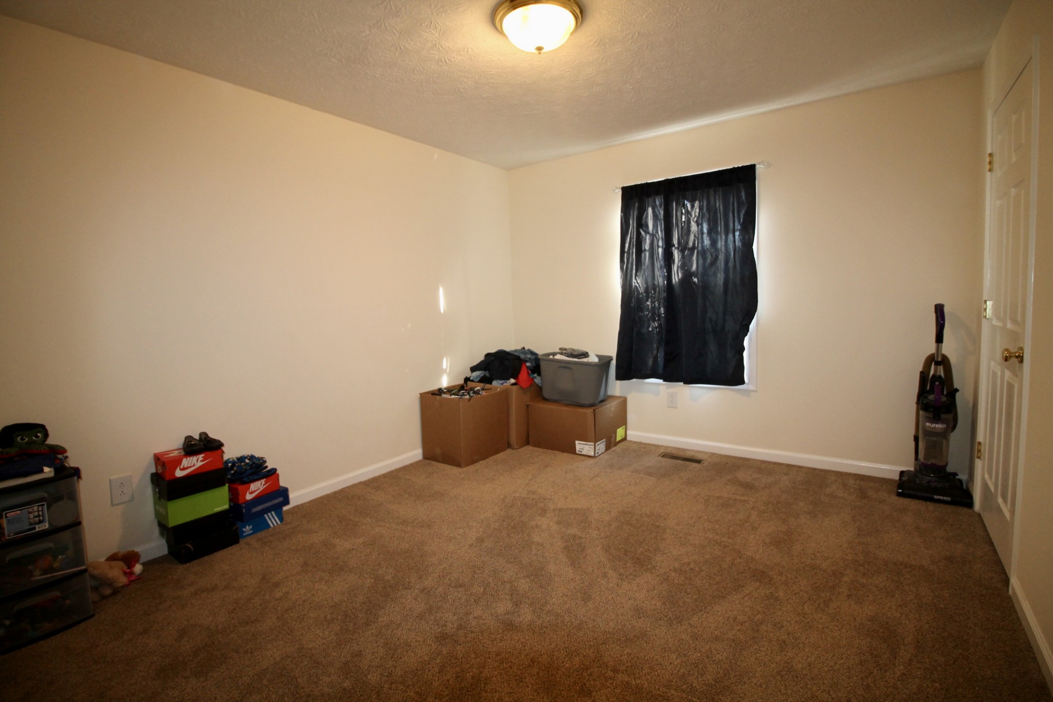 111 Point Road Portland, TN 37148 - Photo 22 of 26 a bed room with a bed and a chandelier
