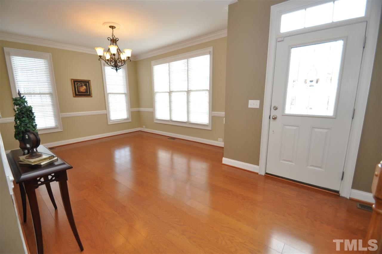 165 Fort Jackson Road Morrisville, NC 27560 - Photo 2 of 25 a view of an empty room with wooden floor and a window