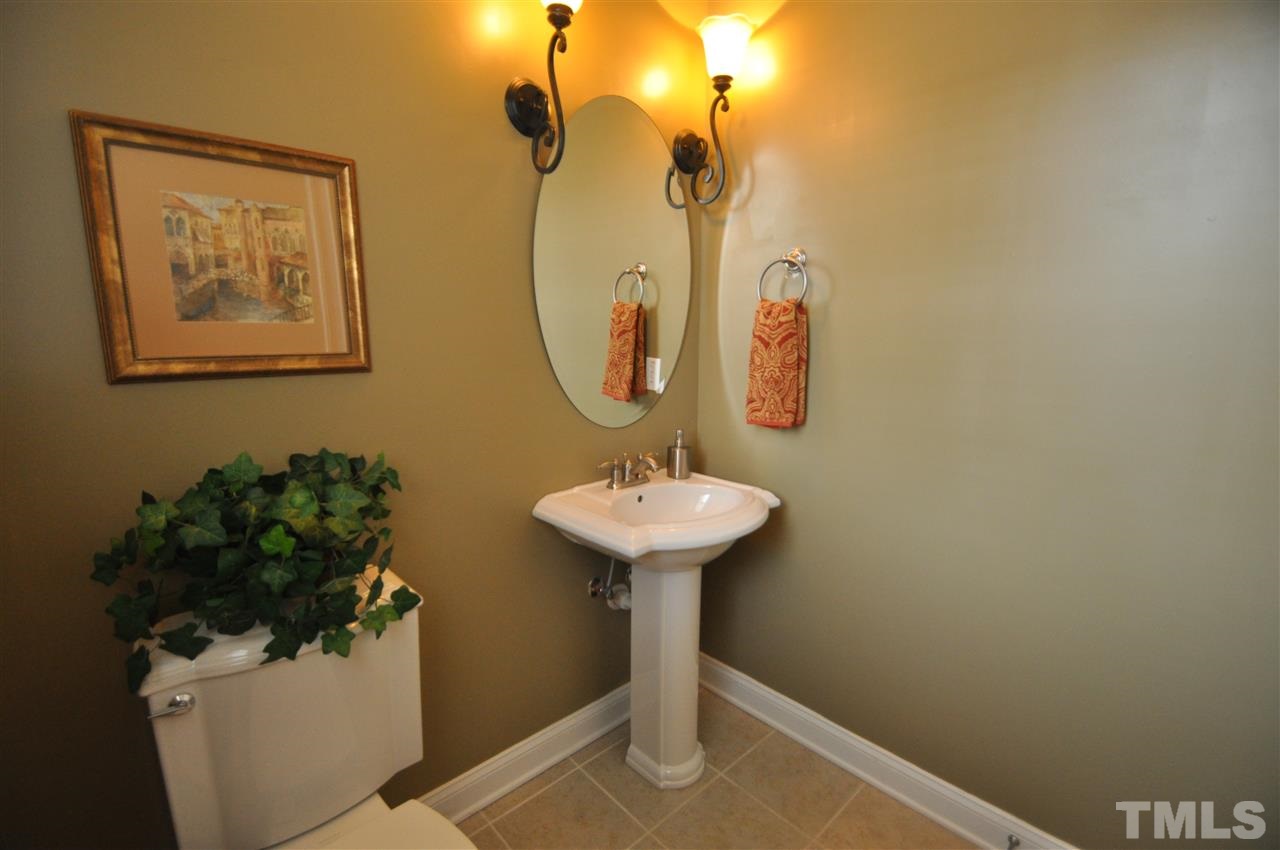 165 Fort Jackson Road Morrisville, NC 27560 - Photo 13 of 25 a bathroom with a sink and mirror
