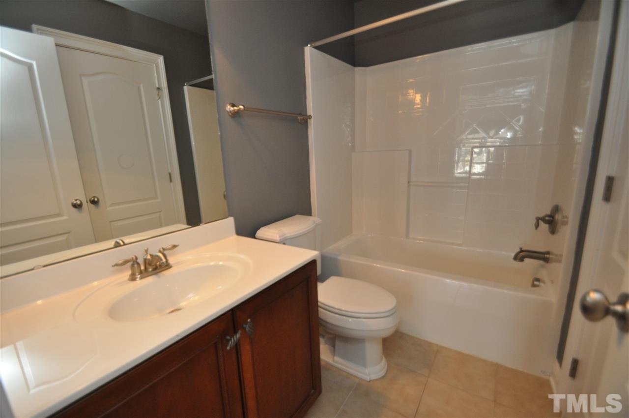 165 Fort Jackson Road Morrisville, NC 27560 - Photo 24 of 25 a bathroom with a sink a toilet and shower