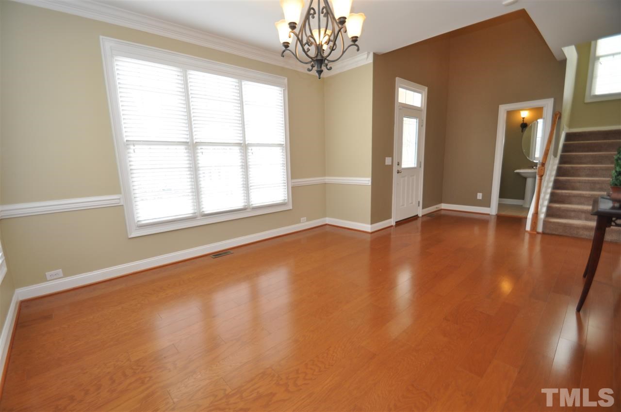 165 Fort Jackson Road Morrisville, NC 27560 - Photo 4 of 25 wooden floor in an empty room with a window