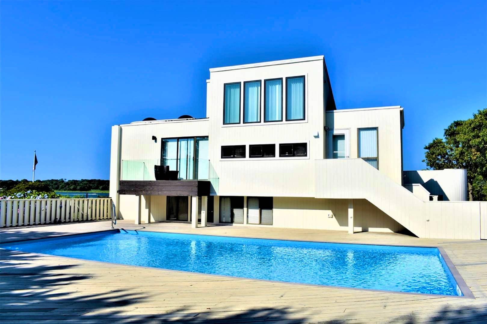 84 Inlet Road East Southampton, NY 11968 - Photo 13 of 13 a view of a living room with furniture and wooden floor