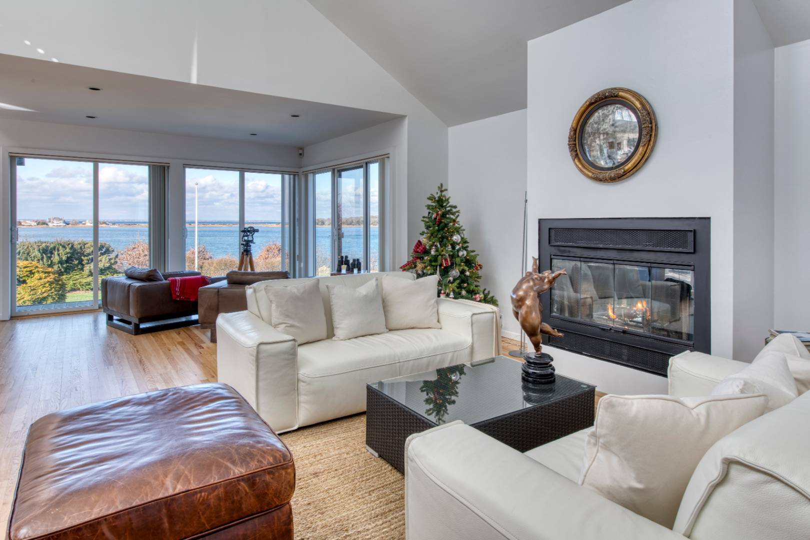 84 Inlet Road East Southampton, NY 11968 - Photo 4 of 13 a living room with furniture and a fireplace