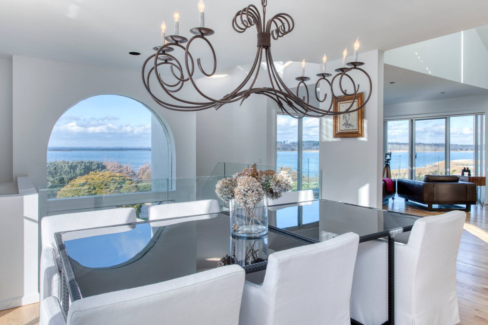 84 Inlet Road East Southampton, NY 11968 - Photo 6 of 13 a living room with furniture a chandelier and a large window