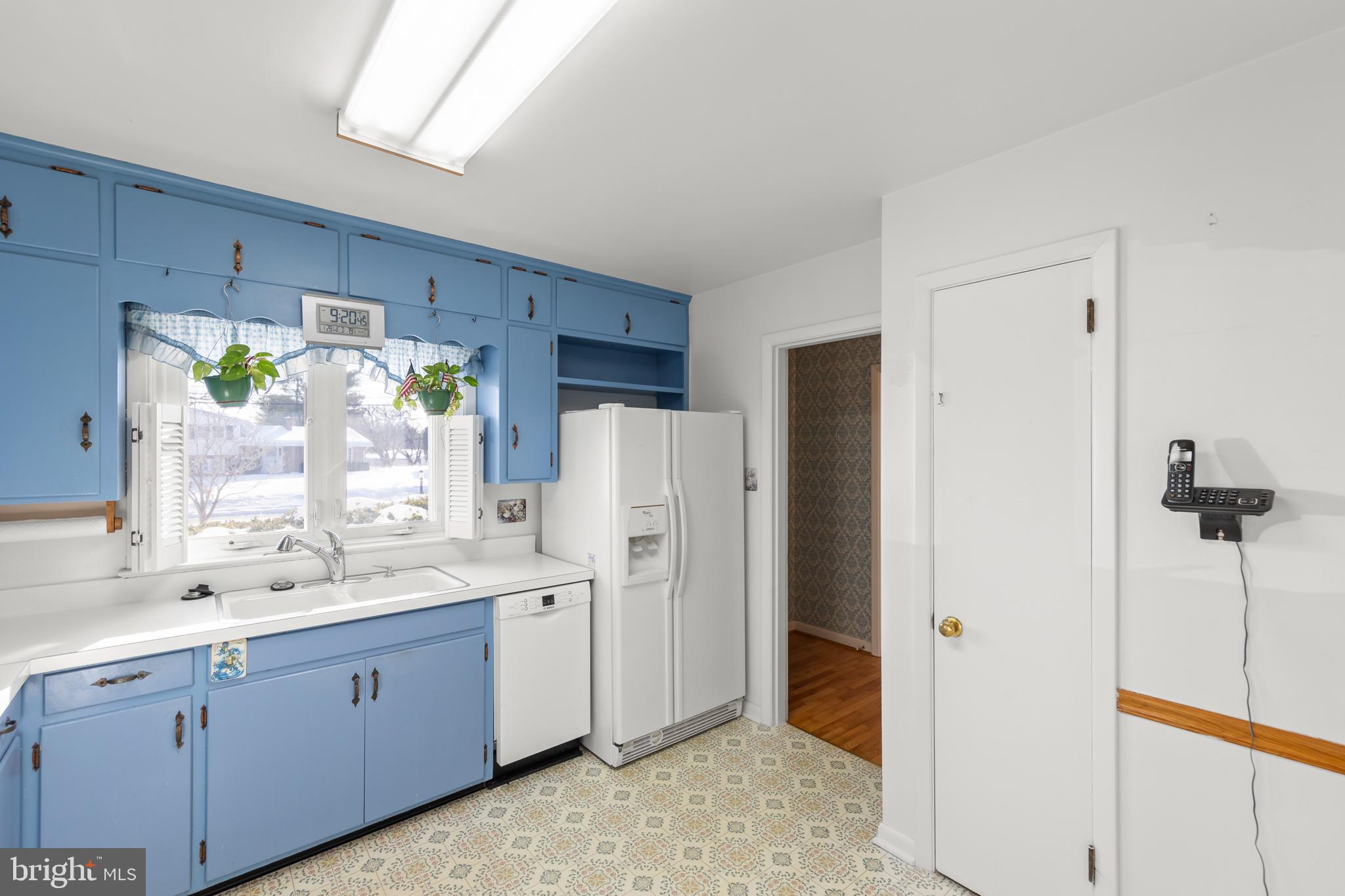 307 Fox Drive Winchester, VA 22601 - Photo 11 of 42 Kitchen showing sink and door to pantry & foyer
