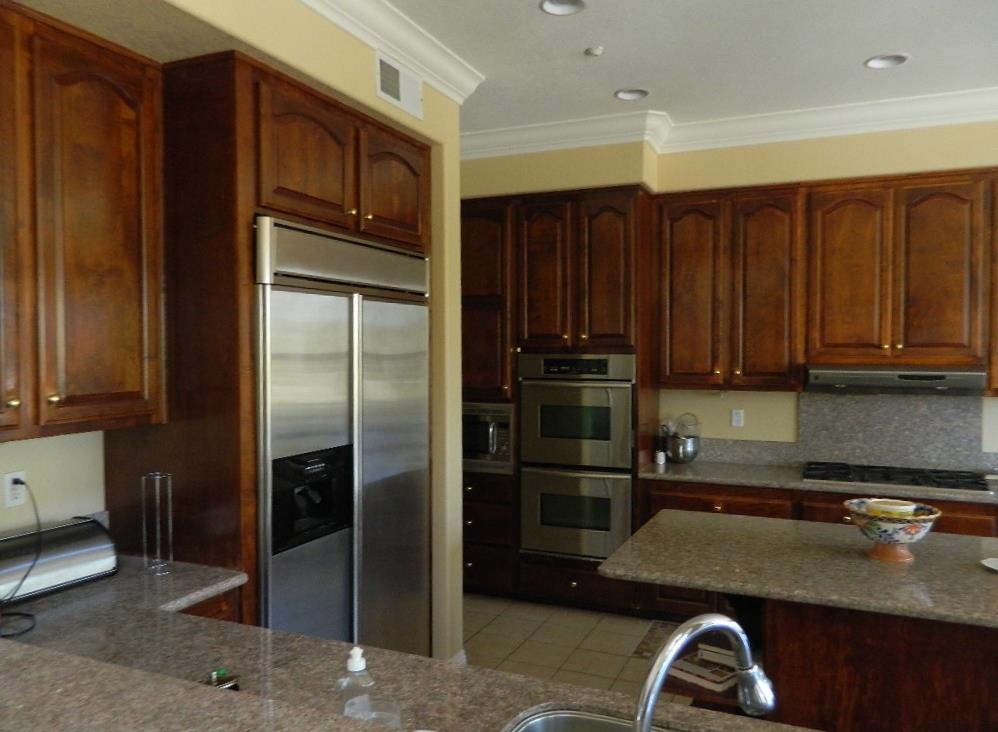 3764 Brookhills Road Fallbrook, CA 92028 - Photo 6 of 15 Custom Cabinets and Stainless Steel Appliances complete with Granite countertops make this an entertainers dream kitchen