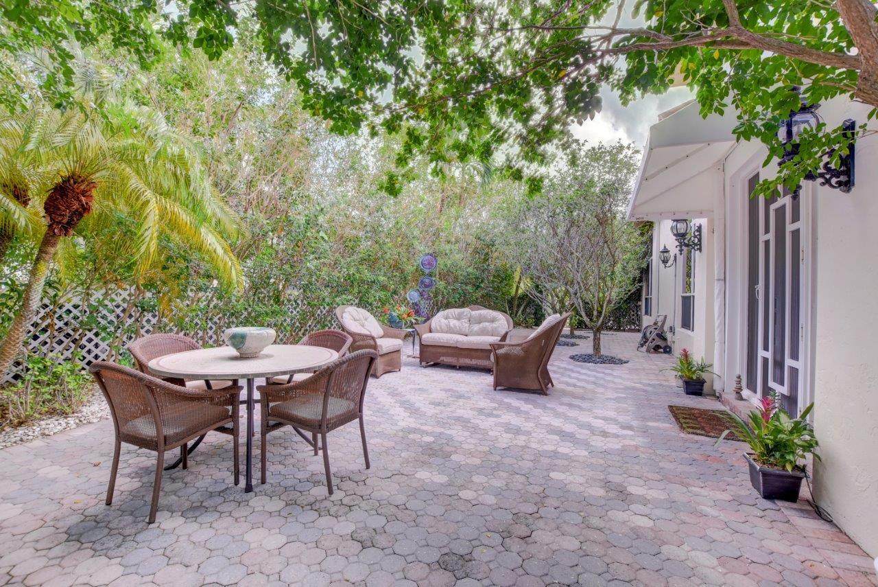 5758 Northwest 24th Terrace Boca Raton, FL 33496 - Photo 6 of 35 a view of a dinning table and chairs in the patio
