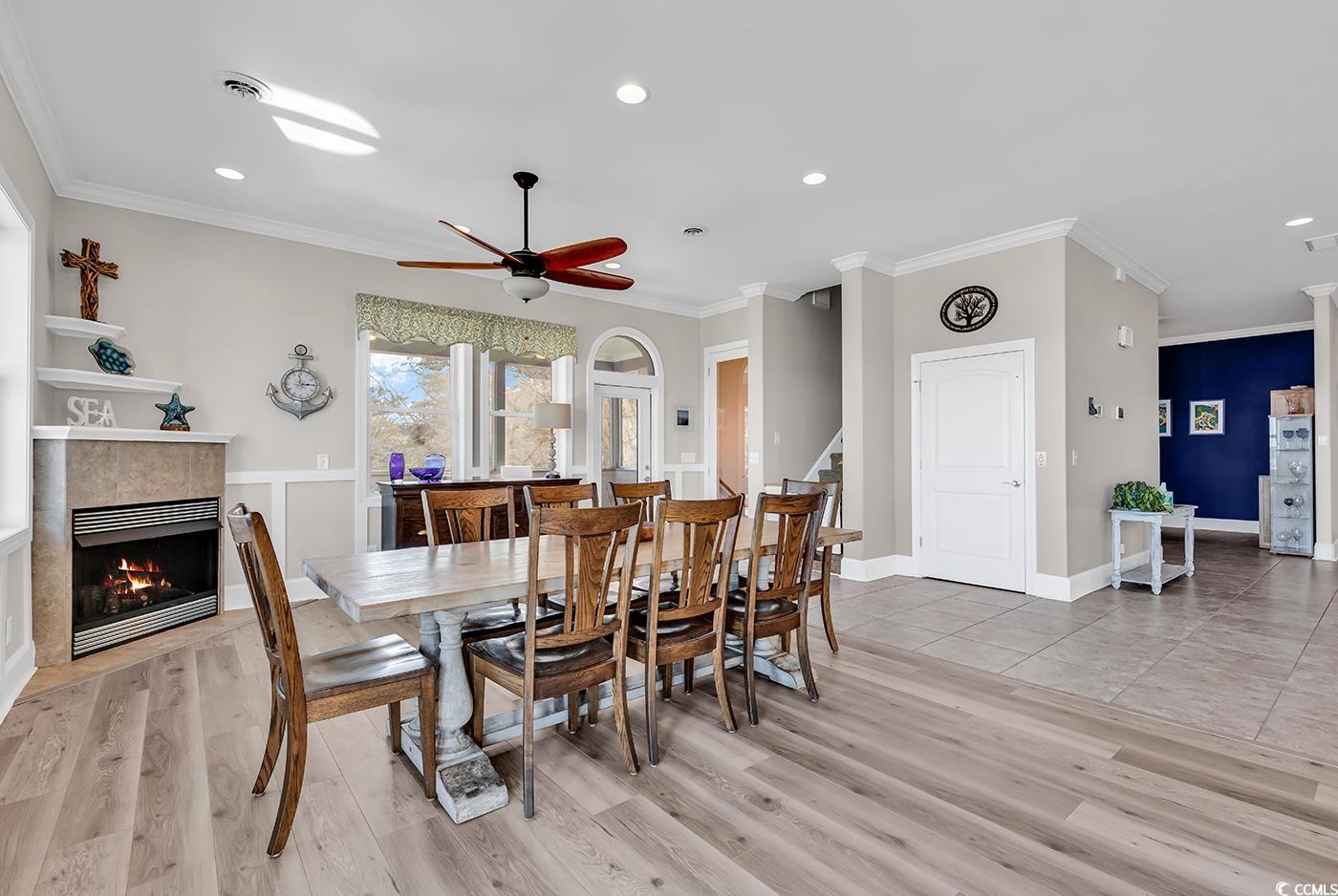 88 Gillette Place Murrells Inlet, SC 29576 - Photo 11 of 40 Dining room with stairway, crown molding, light wo