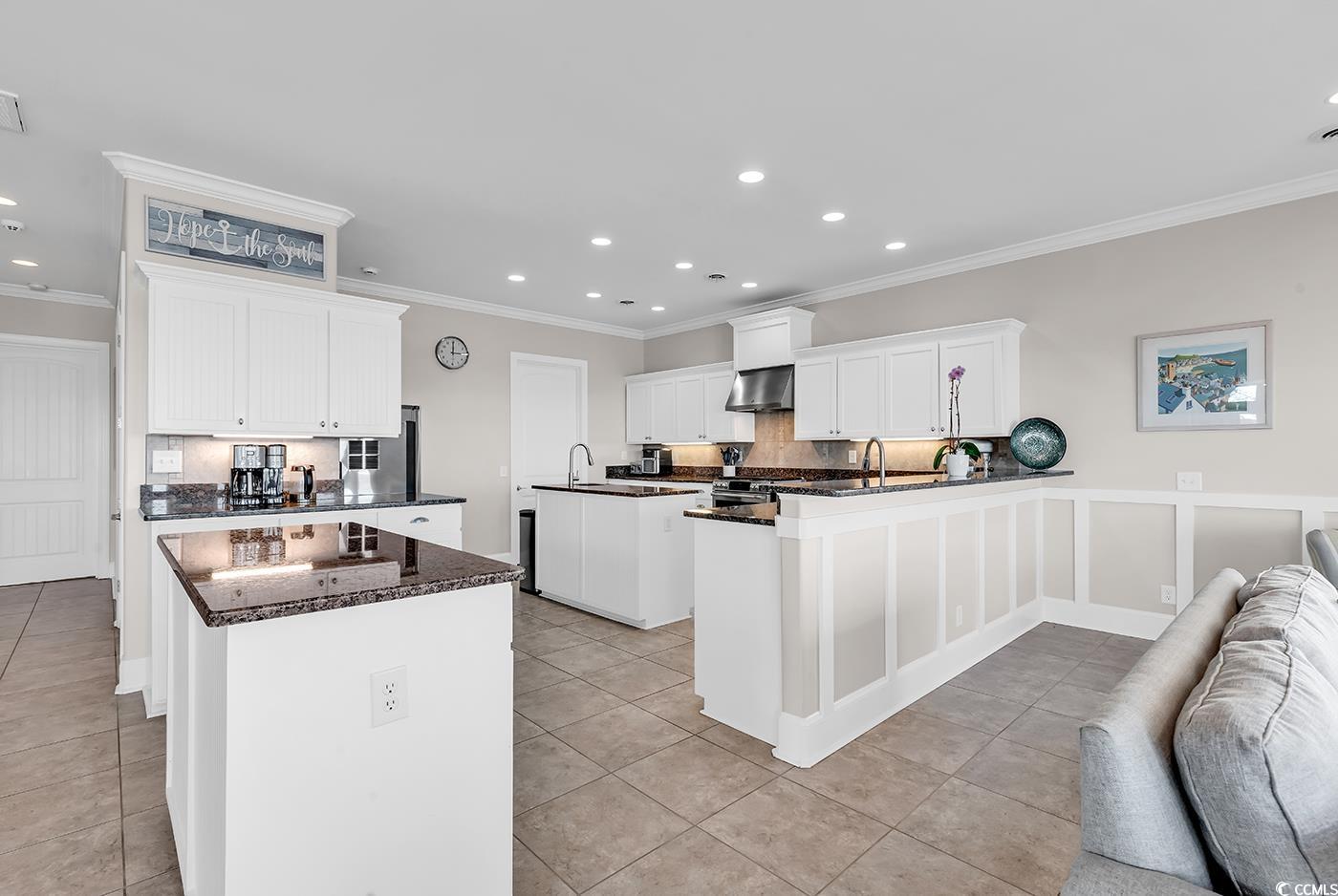 88 Gillette Place Murrells Inlet, SC 29576 - Photo 12 of 40 Kitchen featuring decorative backsplash, wall chim