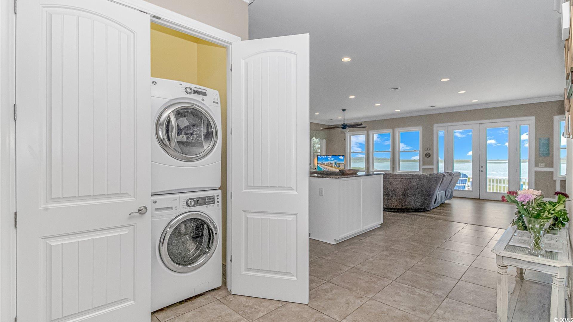 88 Gillette Place Murrells Inlet, SC 29576 - Photo 16 of 40 Washroom with stacked washer and dryer, french doo