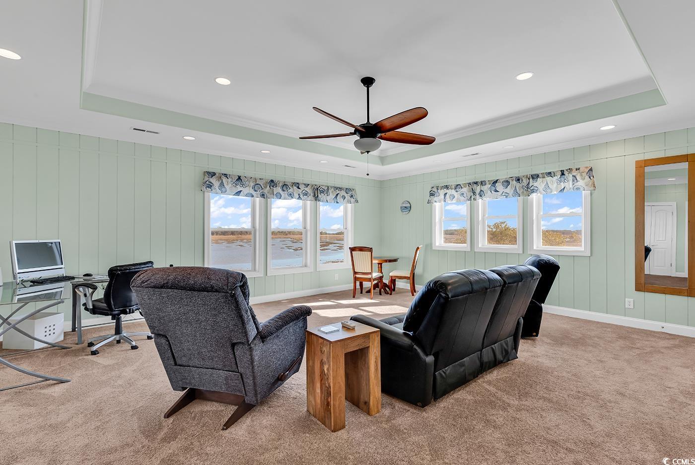 88 Gillette Place Murrells Inlet, SC 29576 - Photo 24 of 40 Living room with a tray ceiling, baseboards, carpe