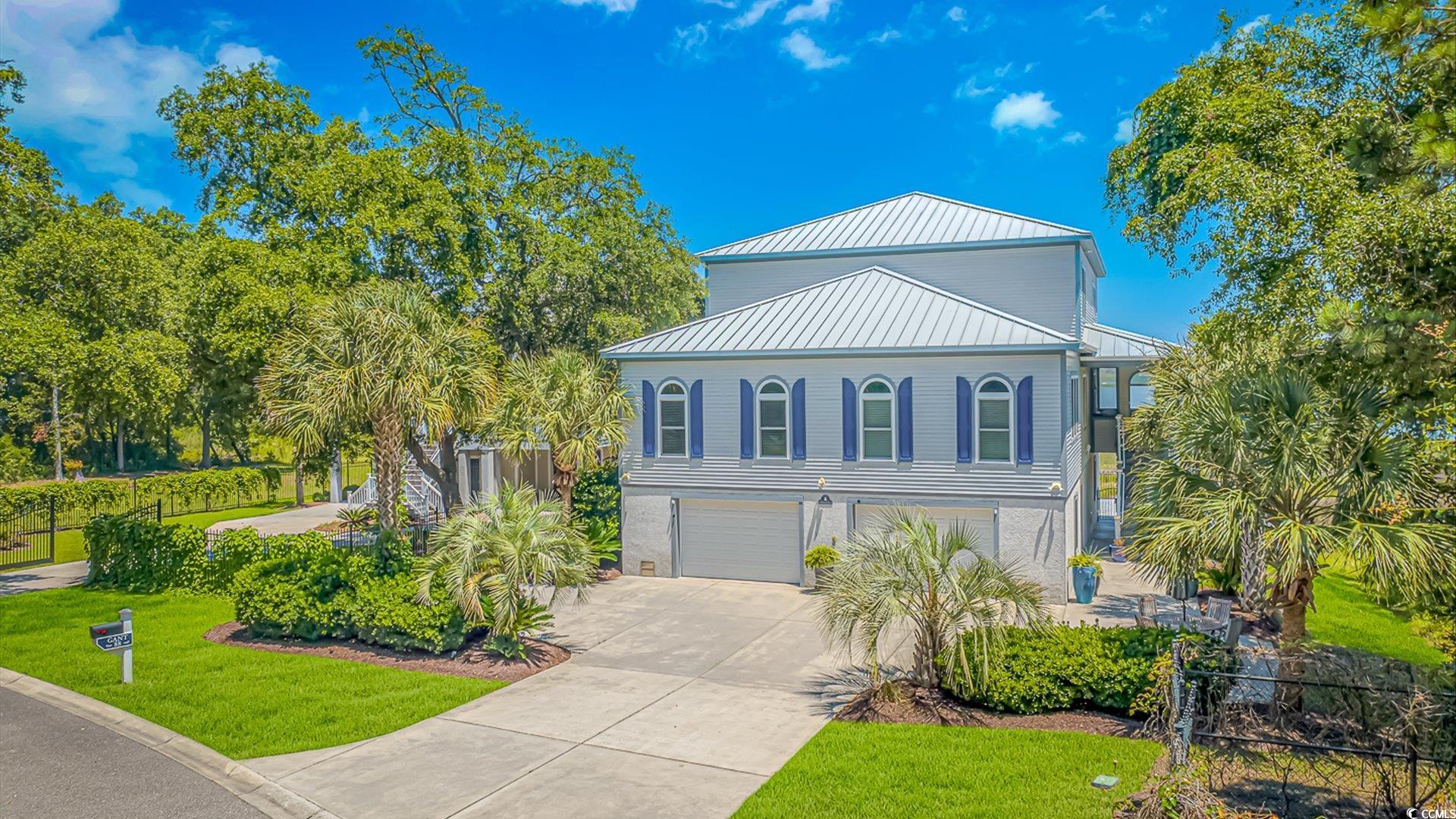 88 Gillette Place Murrells Inlet, SC 29576 - Photo 36 of 40 View of the house featuring the garage space with