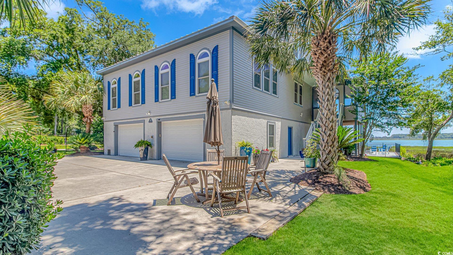 88 Gillette Place Murrells Inlet, SC 29576 - Photo 4 of 40 Exterior space with stairway, an attached garage,