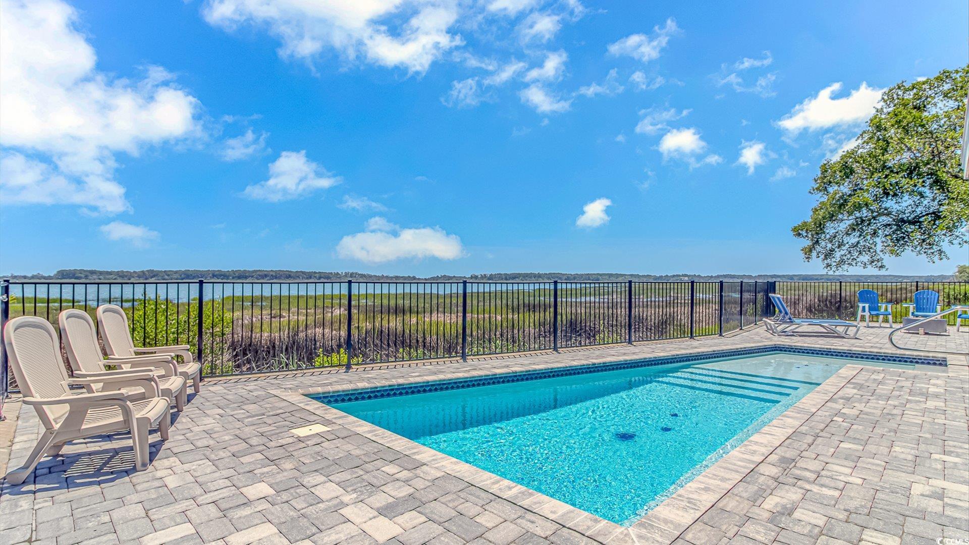 88 Gillette Place Murrells Inlet, SC 29576 - Photo 5 of 40 View of pool with a water view and a patio