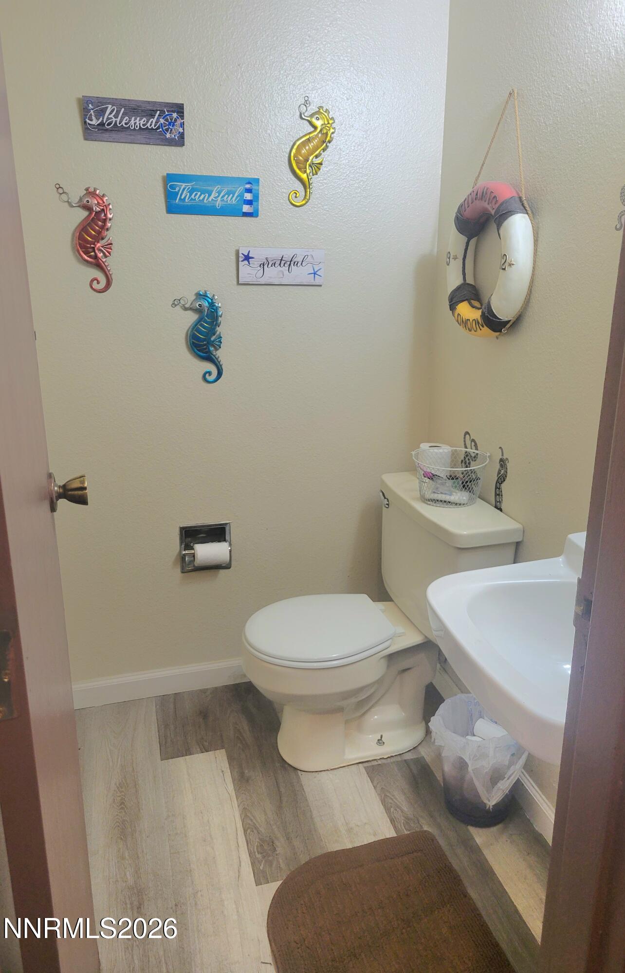 1404 East 9th Street, Unit 3 Reno, NV 89512 - Photo 12 of 29 a white toilet sitting next to a bathroom sink