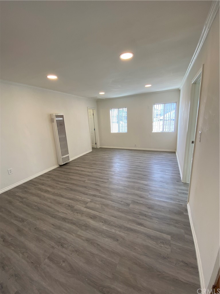 2554 Potrero Avenue El Monte, CA 91733 - Photo 2 of 22 an empty room with wooden floor and windows
