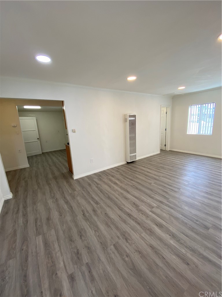 2554 Potrero Avenue El Monte, CA 91733 - Photo 3 of 22 an empty room with wooden floor and windows