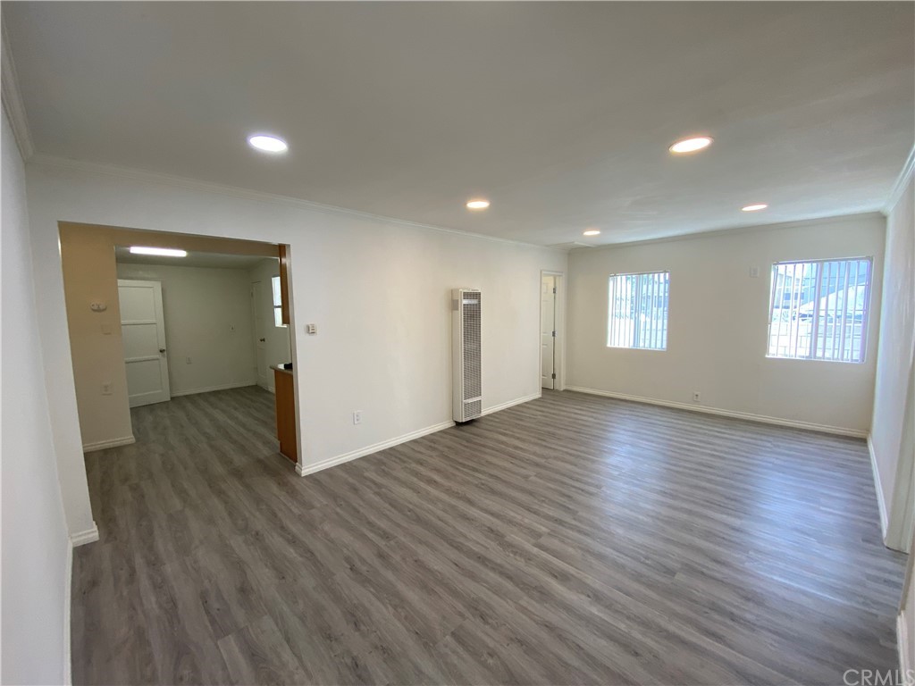 2554 Potrero Avenue El Monte, CA 91733 - Photo 4 of 22 an empty room with wooden floor and windows