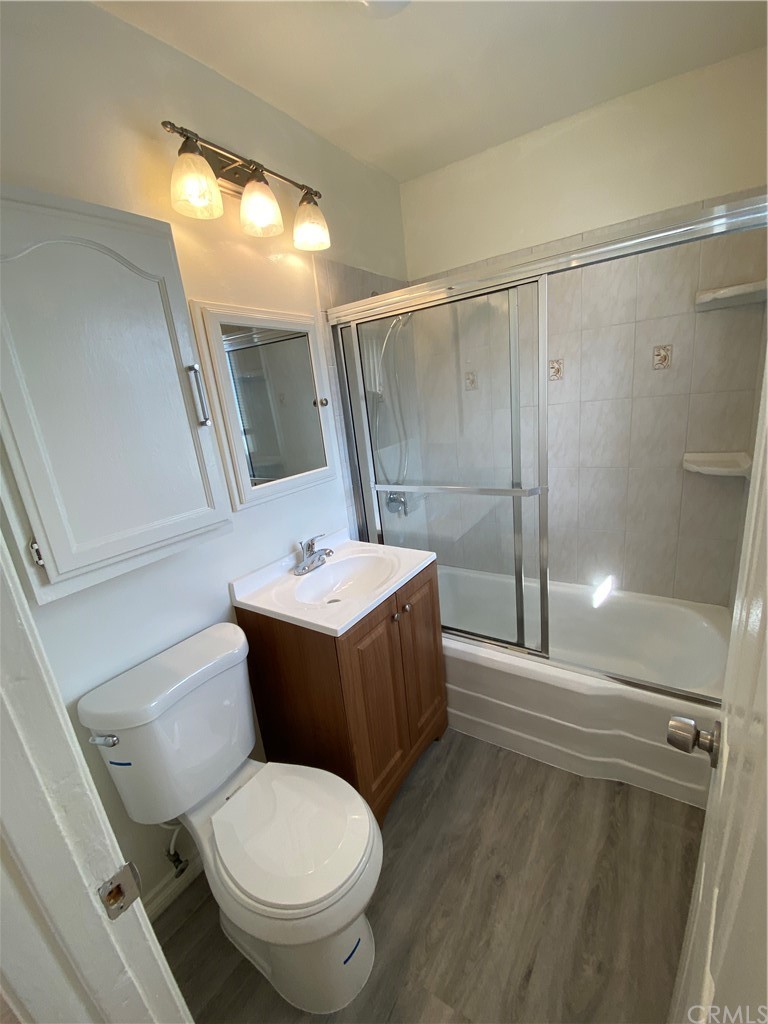 2554 Potrero Avenue El Monte, CA 91733 - Photo 6 of 22 a bathroom with a sink mirror vanity and toilet