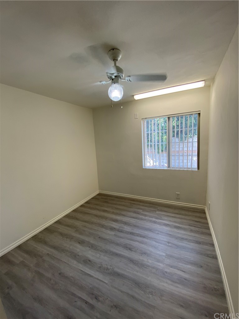 2554 Potrero Avenue El Monte, CA 91733 - Photo 10 of 22 wooden floor in an empty room with a window