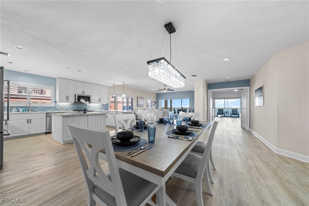 14813 Laguna Drive, Unit 301 Fort Myers, FL 33908 - Photo 16 of 50 a dining room with furniture and window