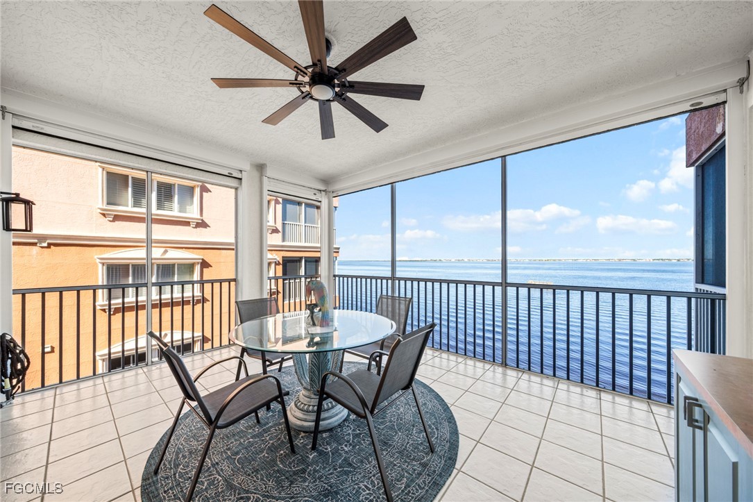 14813 Laguna Drive, Unit 301 Fort Myers, FL 33908 - Photo 18 of 50 a view of a dining room with furniture window and wooden floor