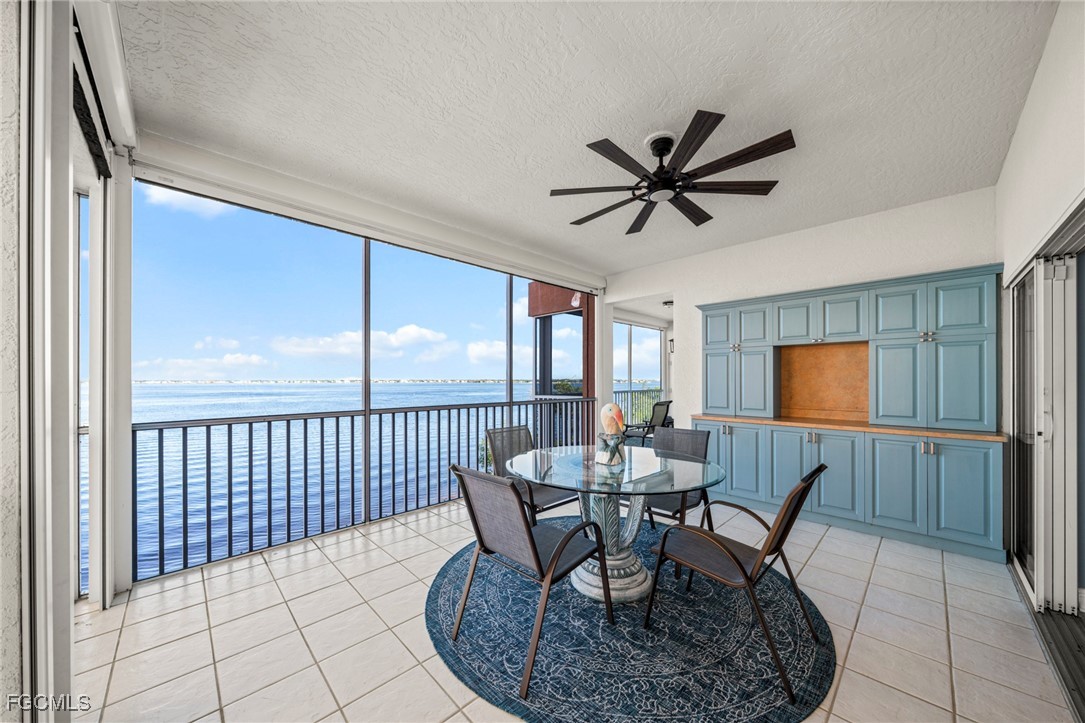 14813 Laguna Drive, Unit 301 Fort Myers, FL 33908 - Photo 19 of 50 a dining room with furniture and window