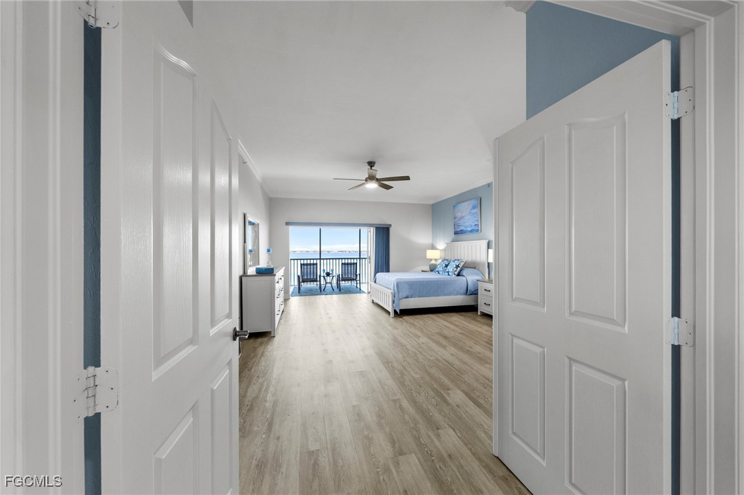 14813 Laguna Drive, Unit 301 Fort Myers, FL 33908 - Photo 21 of 50 a living room with furniture and a chandelier