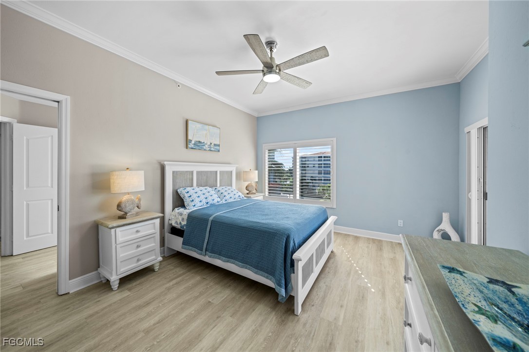 14813 Laguna Drive, Unit 301 Fort Myers, FL 33908 - Photo 26 of 50 a bedroom with a large bed and a window