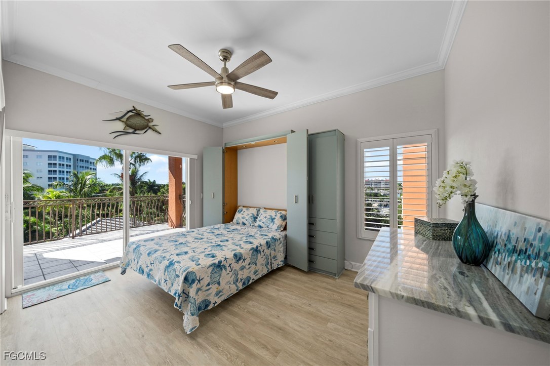 14813 Laguna Drive, Unit 301 Fort Myers, FL 33908 - Photo 29 of 50 a bed sitting in a spacious bedroom next to a window