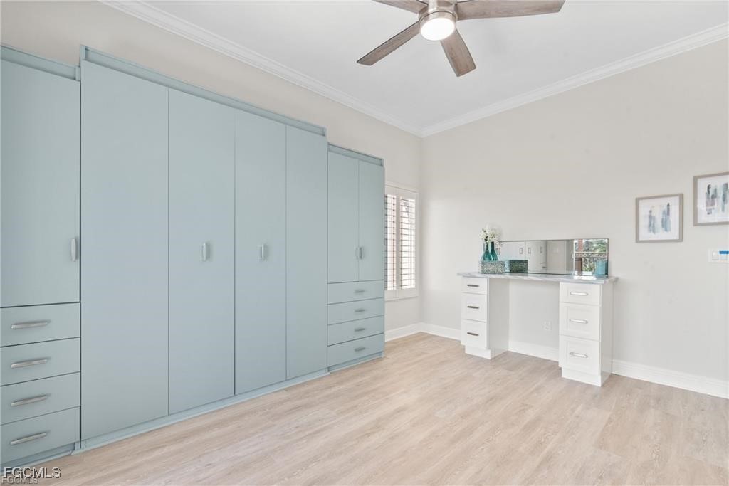 14813 Laguna Drive, Unit 301 Fort Myers, FL 33908 - Photo 30 of 50 a room with a white bed and cabinets