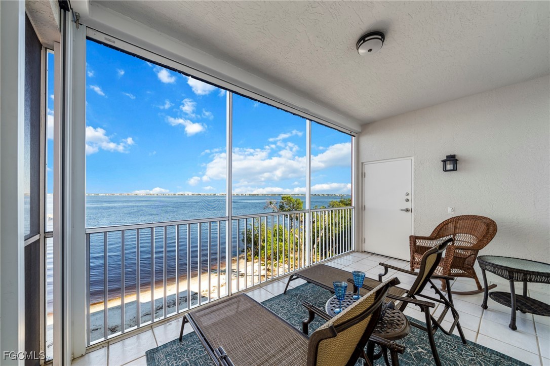 14813 Laguna Drive, Unit 301 Fort Myers, FL 33908 - Photo 33 of 50 a living room with a large window