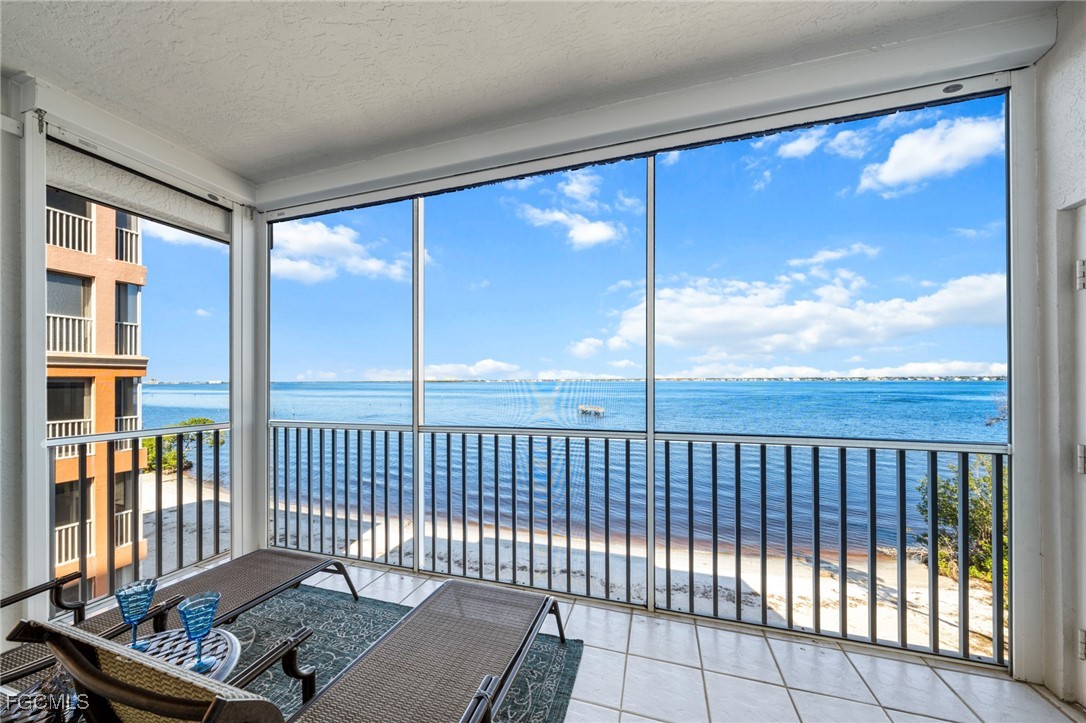 14813 Laguna Drive, Unit 301 Fort Myers, FL 33908 - Photo 34 of 50 a view of a balcony with a swing