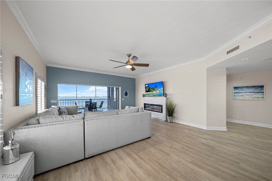 14813 Laguna Drive, Unit 301 Fort Myers, FL 33908 - Photo 9 of 50 a living room with furniture and a chandelier