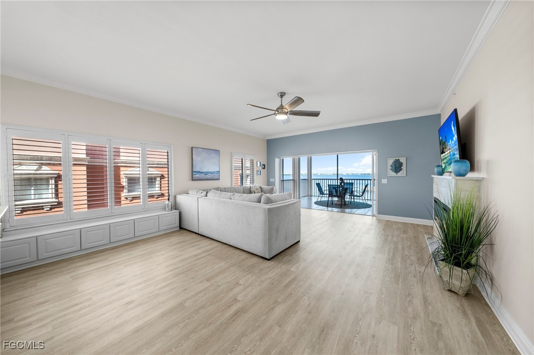 14813 Laguna Drive, Unit 301 Fort Myers, FL 33908 - Photo 10 of 50 a living room with furniture and a large window
