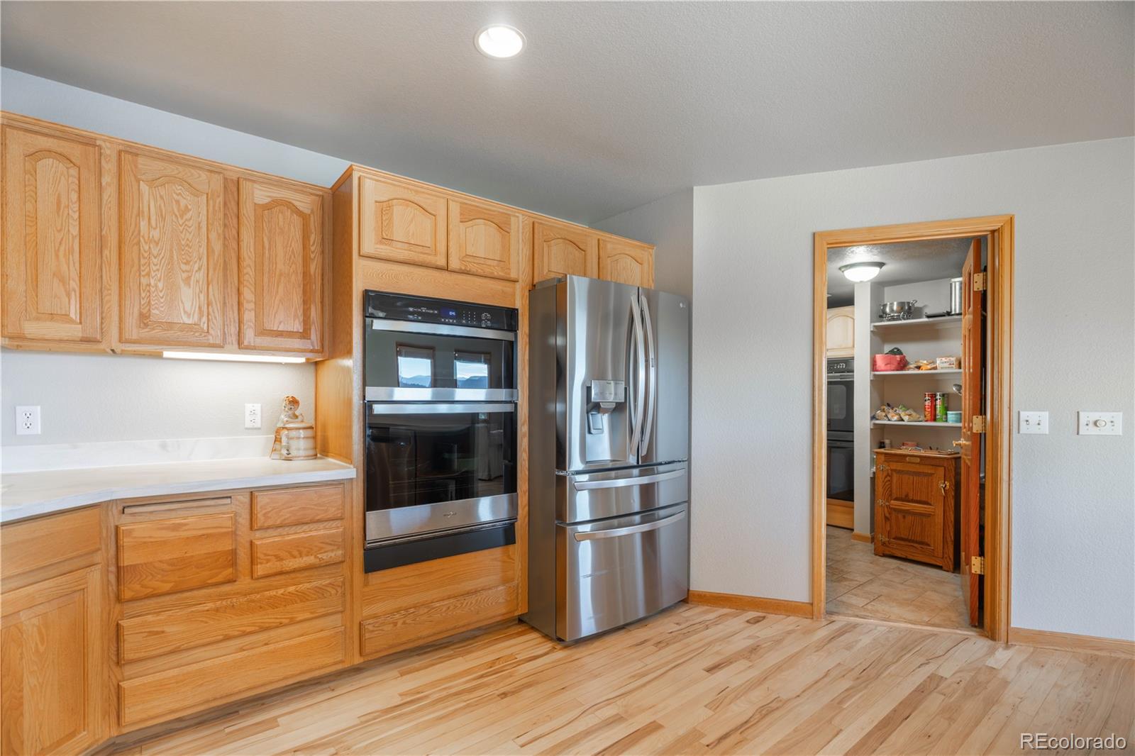 318 Rd D Pine, CO 80470 - Photo 13 of 50 a kitchen with granite countertop stainless steel appliances and refrigerator