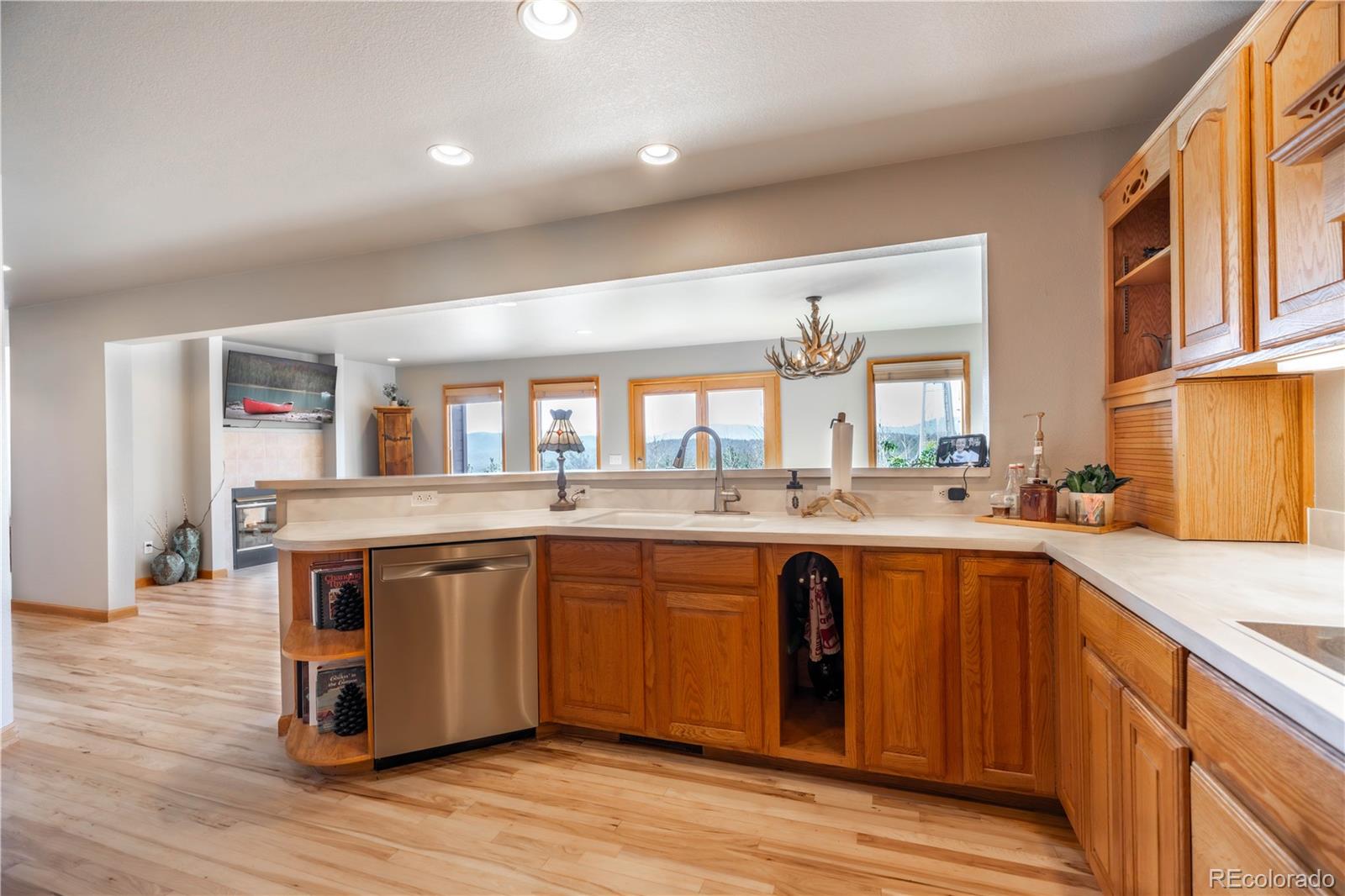 318 Rd D Pine, CO 80470 - Photo 14 of 50 a large kitchen with stainless steel appliances granite countertop a sink and cabinets
