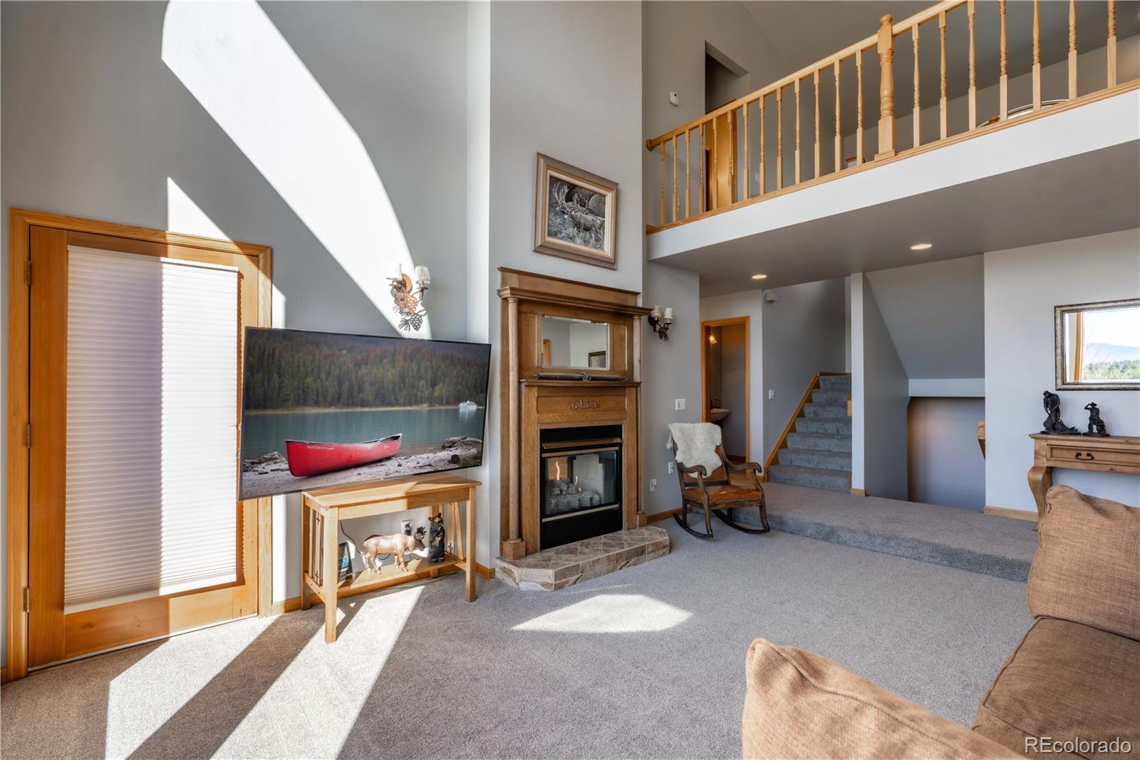 318 Rd D Pine, CO 80470 - Photo 6 of 50 a living room with furniture and a fireplace