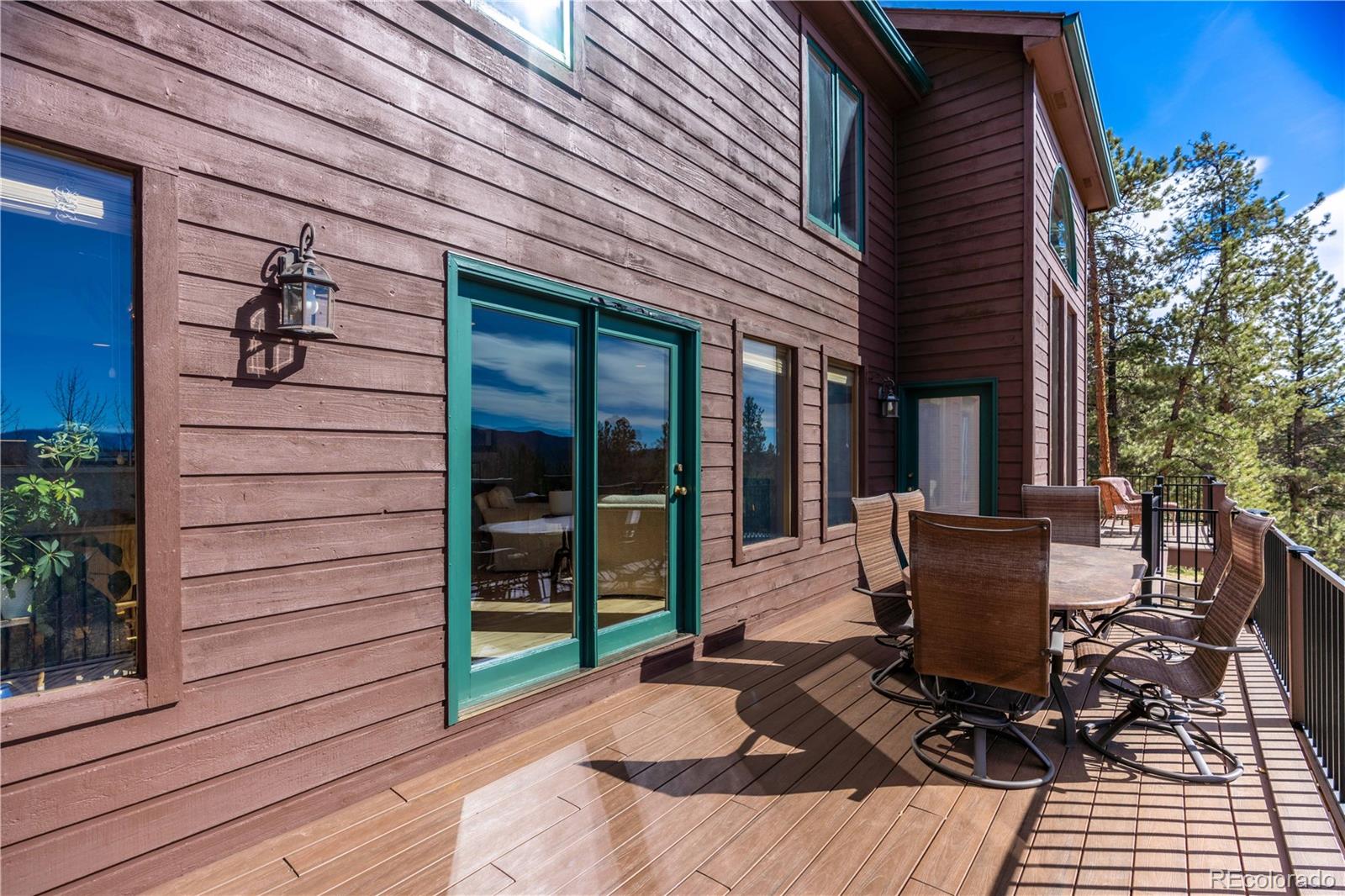 318 Rd D Pine, CO 80470 - Photo 10 of 50 a view of a patio with table and chairs and potted plants