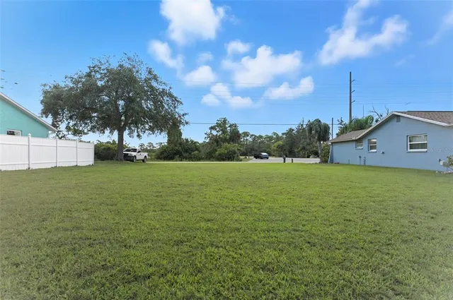 a view of a lake with a yard