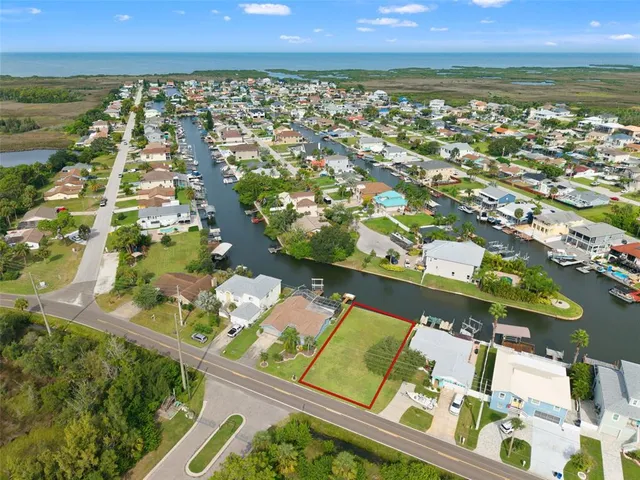 an aerial view of a house with a swimming pool