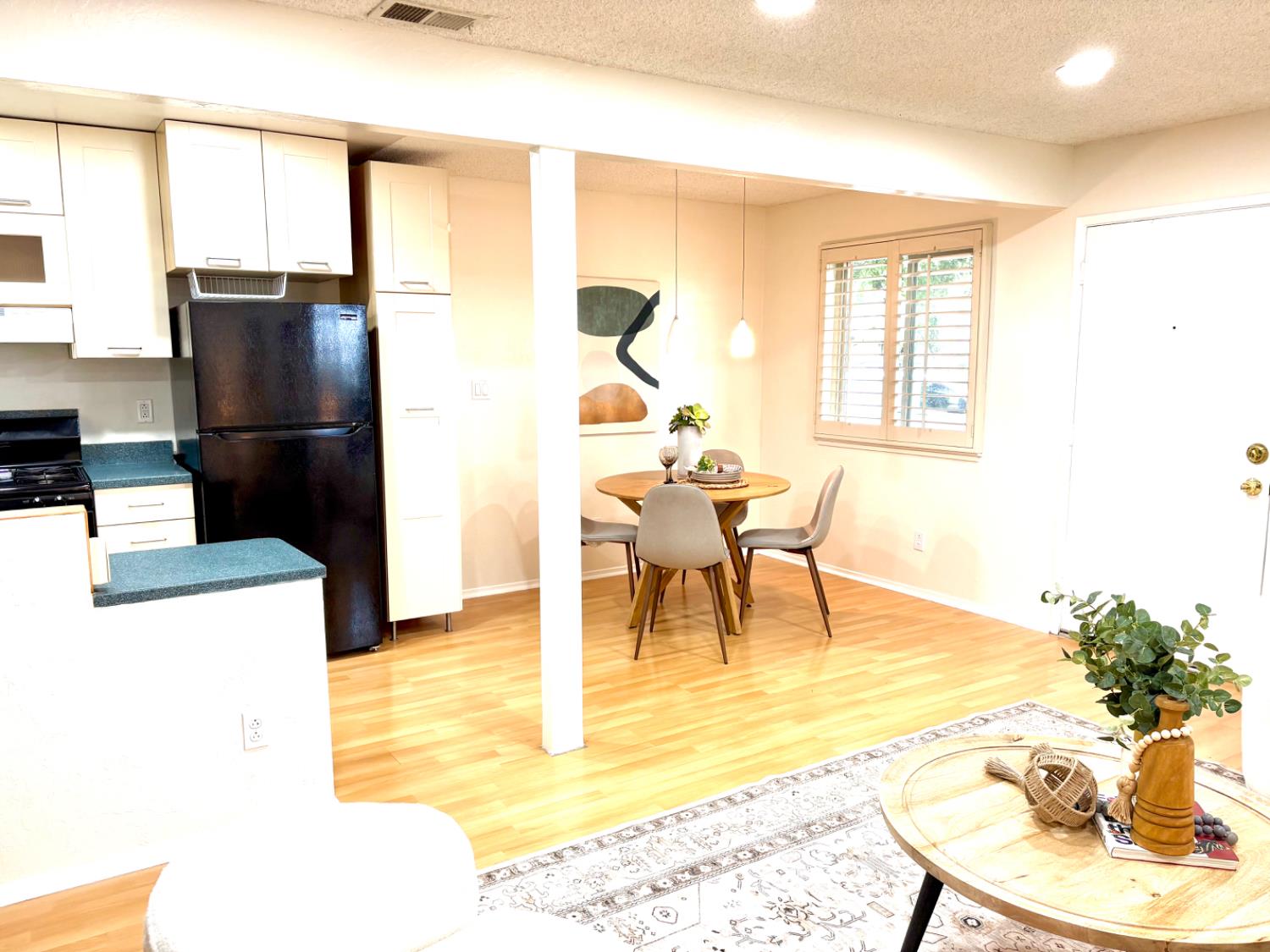 2900 Pole Line Road, Unit 2 Davis, CA 95618 - Photo 6 of 34 a living room with furniture a refrigerator and a dining table