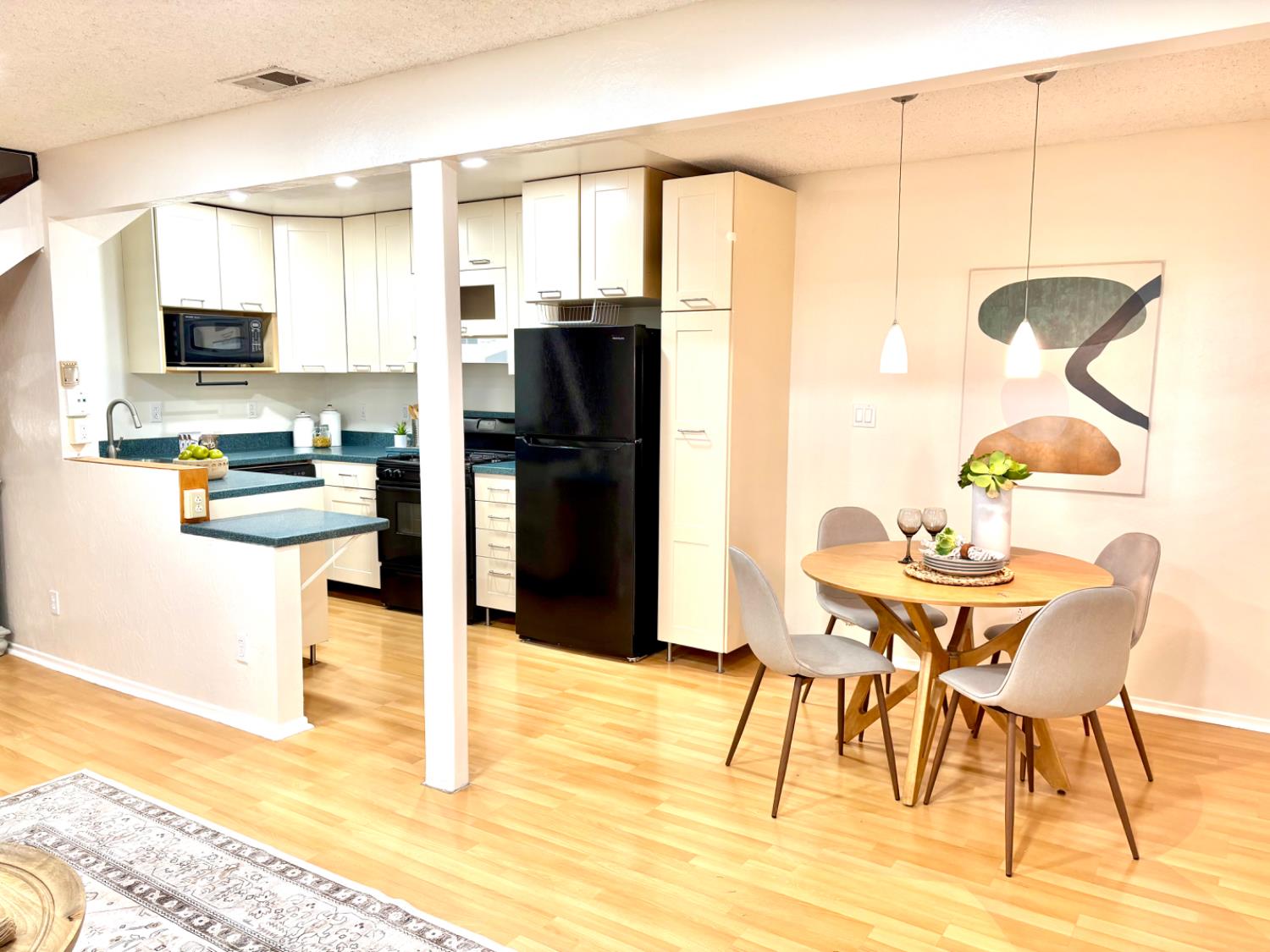 2900 Pole Line Road, Unit 2 Davis, CA 95618 - Photo 7 of 34 a kitchen with stainless steel appliances kitchen island granite countertop a refrigerator and a stove top oven
