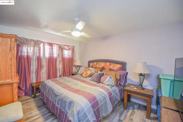 a bedroom with furniture and a window