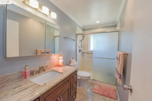 a bedroom with furniture and wooden floor