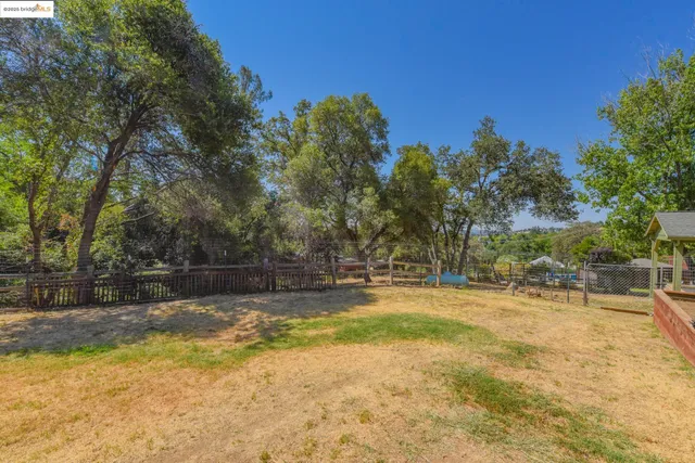 a view of backyard with green space